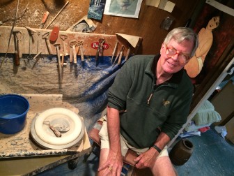 New Canaan resident George McEvoy, a retired marketer and active potter, in his workshop/studio on Seminary Street. Credit: Michael Dinan