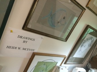 Heidi McEvoy's drawings adorn the walls at the pottery studio in New Canaan. Credit: Michael Dinan