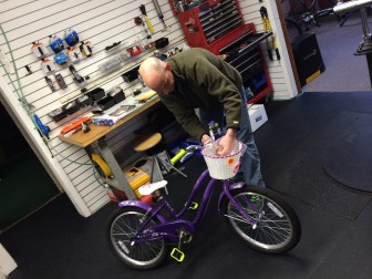 Lou works on a bike at Cycles on Call, a full-service bike shop. As spring cleaning gets underway in New Canaan, plenty of people are getting bikes ready. Credit: Michael Dinan