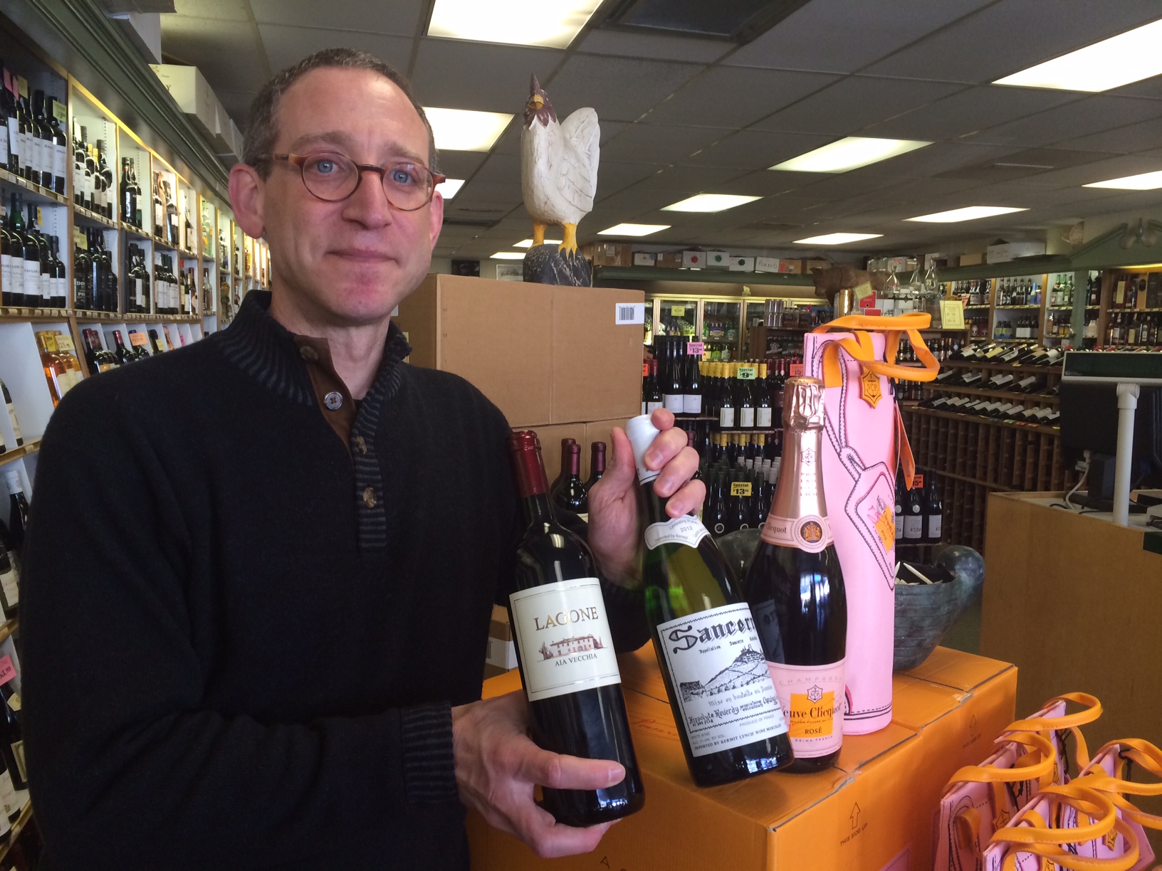 Carl Franco of Francos Wine Merchants on Elm Street in New Canaan, with some Valentine's Day options. Credit: Michael Dinan