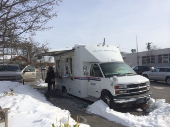 Post Office officials say this mobile truck for retail services is a temporary situation, and that services will be centralized at 90 Main St. Credit: Michael Dinan