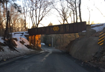 Despite existing signage, truckers regularly drive into the railroad overpass on Route 106 between Weed Street and Lapham Road. New Canaan will petition ConnDOT to put warning objects on the bridge itself. Credit: Michael Dinan