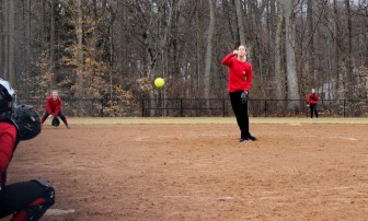 New Canaan's Jamie Schlim fires in a pitch at Saturday's scrimmage in Darien.