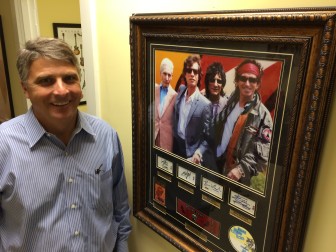 Phil Williams, owner of New Canaan Music with some Rolling Stones memorabilia, which his shop sells as well as instruments (including rentals), lessons and accessories.