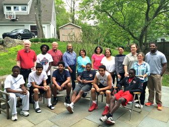 At a May 21, 2014 ABC House of New Canaan gathering, including current student-residents and former New Canaan High School students from the early 1970s who pushed for the program's founding in town, as well as current board members and co-resident directors. Standing, L-R: Mike Curran, Osaze Wilson, Allen Haas, Robert Jeffries, Maryann (Ruggiero) Gabriel, Laura Walsh, Jennifer James, Janice Benson, John Walsh, Beth Jones and Tony Adams. Sitting, L-R: Rajon Mitchell, Chris Roman, Myles Henderson, Chris Andrews, Brian Maccalla and Kwaku Gyasi. Missing: ABC student Markiz Harmon. Present for the event though not in this particular photo are ABC board members and fundraiser co-chair Amy Burger and Candace Curran. Credit: Michael Dinan