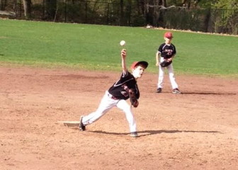 9u Pride pitcher Danny Rogers hurls a strike.