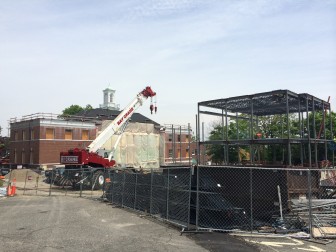 The first of three "bays" out back of Town Hall—a major part of the buildings renovation—now are outlined in steel frames, and the project's construction manager says the entire steel skeleton should be up by June 20. Credit: Michael Dinan