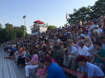 Family, friends and supporters crowded into the home field-side grandstands and in the plaza above for the New Canaan High School graduation ceremony on June 17, 2014. Credit: Michael Dinan