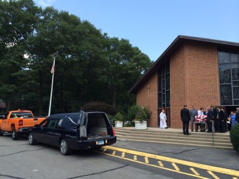 An escort from New Canaan, Norwalk and Westport Police led those gathered July 29, 2014 at St. Jerome Roman Catholic Church in Norwalk to Willowbrook Cemetery in Westport, where Ben Olmstead was interred. He died July 24 at age 71. Credit: Michael Dinan