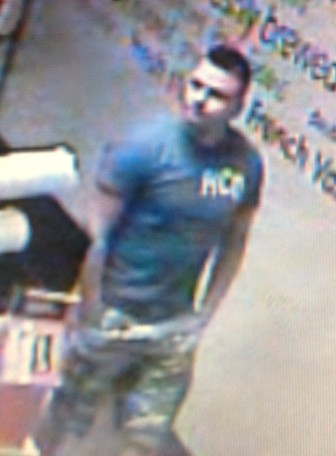 New Canaan Police say that at about 7:04 a.m. on July 15, this man pocketed another customer's wallet at the Dunkin Donuts on Elm Street. Photo courtesy of the New Canaan Police Department