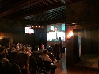 Gabrielle (Geddis) Griffin remembers her father, the late Briggs Geddis, longtime director of environmental health in New Canaan, in front of an overflowing crowd in the Great Hall at Waveny House. The memorial event for Geddis took place Aug. 7, 2014. Credit: Michael Dinan