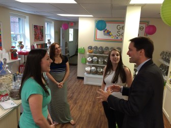 U.S. Rep. Jim Himes (D-4) chats with Megan, Toni and Lauren Palladino at The Candy Scoop in New Canaan on Aug. 22. Toni's daughters own and operate the popular candy shop. Credit: Michael Dinan