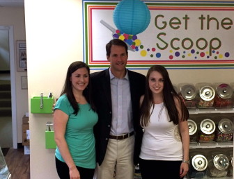 Lauren (L) and Megan Palladino, co-owners of The Candy Scoop on Elm Street, with U.S. Rep. Jim Himes. Credit: Michael Dinan