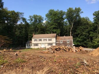Much of the 2-acre property at 114 Skyview Lane has been clearcut. Though the 50-year-old Colonial still stood there as of Aug. 8, a new home with double the living space is planned. Credit: Michael Dinan
