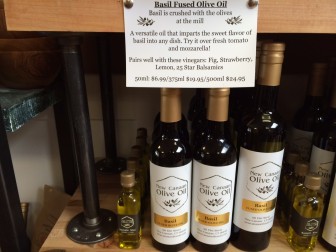 The basil-infused extra virgin olive oil is the single most-popular item at New Canaan Olive Oil, owner Heidi Burrows says. Credit: Michael Dinan