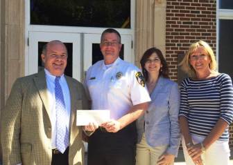 Bo Harrigan of Harrigan Insurance, Police Chief Leon Krolikowski, Roberta Hardy and Cate Breslin both of Harrigan Insurance. Contributed photo