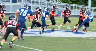 Griffin Gentner (#23) applies the hit as his fellow teammates continue their pursuit. (Diane Rasso photo)