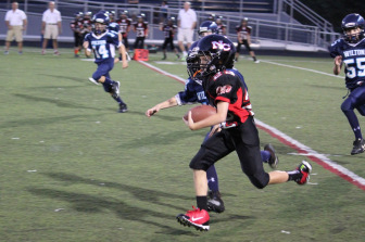 Brendan Hagan scores New Canaan's only TD on the day via a 69-yard pass from Ty Groff. (Jen Gentner photo)