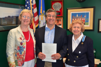 Pictured at the proclamation signing are Chapter Regent Diane Wells, First Selectman Robert E. Mallozzi III, and Lila Zwart. Contributed photo