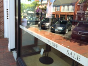 Here's a sign taped inside the window of a shop on Elm Street. Credit: Michael Dinan