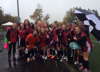 New Canaan 7th Grade Red Field Hockey braved the elements this weekend to notch a victory vs. Fairfield. Contributed photo