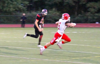 Michael Kraus sets up a Rams score with an INT. Credit: Terry Dinan