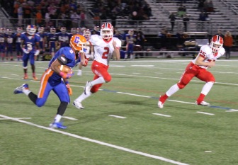 Teddy Dumbauld (#2) and Cass Knox (#25) chase down a Danbury runner. Credit: Terry Dinan