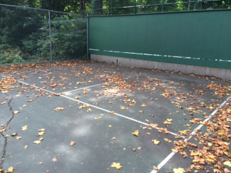 Town officials voted in October 2014 to spend $6,500 repairing the asphalt at this practice tennis court in Mead Park. Credit: Michael Dinan