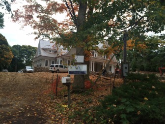 The multiple contractor signs affixed somehow to a tree here on Elm Place also appear to be in direct violation of New Canaan's Zoning Regulations. Credit: Michael Dinan