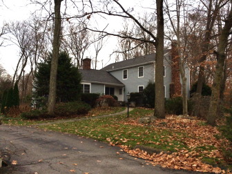 This 1976-built, 4-bedroom Colonial at the very end of Putnam Road, down a shared driveway at the cul-de-sac, sold in November 2014 for $1,575,000. It sits on 1.19 acres and was issued permits for a new deck, interior renovation and finished basement all within the last 10 years, according to its assessor card. Credit: Michael Dinan