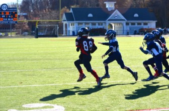 Henry Garrity scores the first NC TD of the day. Credit: Diane Rasso
