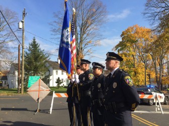 The New Canaan Police Department Color Guard stands by during the Nov. 11, 2014 Veterans Day ceremony at God's Acre. Capt. Vincent DeMaio in the foreground. Credit: Michael Dinan