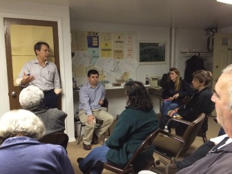 New Canaan Housing Authority Chairman Scott Hobbs (standing, left) addresses residents of Millport Apartments during an information session on the proposed redevelopment project there, Nov. 12, 2014. Credit: Michael Dinan