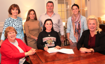 Emma Novick of New Canaan, a senior at Convent of the Sacred Heart, Greenwich, signed a National Letter of Intent to play Division 1 lacrosse for Lafayette College.  Emma will graduate with the Class of 2015 at Convent of the Sacred Heart and attend the Lafayette in fall 2015. She is pictured here (center wearing her college shirt) with from left right first row, Jayne Collins, head of the Upper School; Kirsten; Pamela Juan Hayes, head of school for Convent of the Sacred Heart. Second row, Kelly Stone, director of athletics; parents Lisa and Steven Novick; and coach Courtney DePeter.  Contributed photo