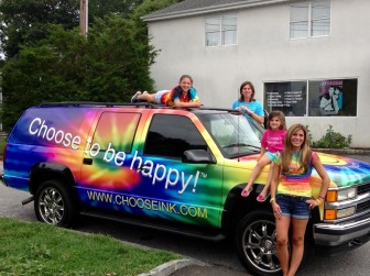 Matt Konspore's family with the "Choose To Be Happy" automobile. Contributed