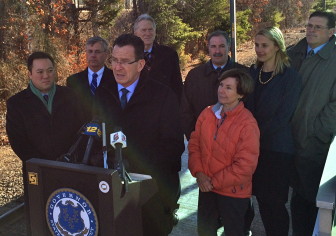 Gov. Dannel Malloy addresses the press at Springdale station on Jan. 13, as he announced that new M-8 cars are starting on Metro-North Railroad's New Canaan branch line. Credit: Michael Dinan