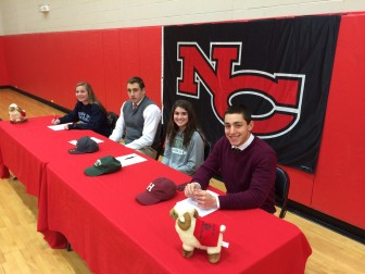 L-R: New Canaan High School seniors Alissa Valente (Bentley University, soccer), Zach Allen (Boston College, football), Isabel Taben (Dartmouth, lacrosse) and Alex LaPolice (Harvard, football) sign their lettes of intent to play sports in college, on Feb. 4, 2015. Credit: Michael Dinan