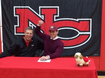 The great relationship between Rams Football Coach Lou Marinelli and his players—here's Harvard-bound Alex LaPolice—was evident at the Feb. 4, 2015 National Letter of Intent signing ceremony. Credit: Michael Dinan