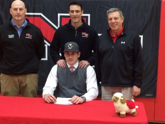 Zach Allen signs on to play football at Boston College on Feb. 4, 2015. Here he is with some of the Rams' coaches (L-R): Jason Miska, Chris Silvestri and Lou Marinelli. Credit: Michael Dinan