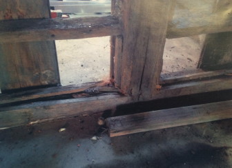 A photo showing some of the rot in the wood of the barn at 388 West Road.