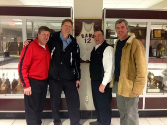 L-R: Tad Keating, Monroe Trout, Rob Lenihan and Matt Ready, standing before the Wilky Gilmore jersey outside the gym at New Canaan High School during the varsity boys basketball team on Senior Night, Feb. 23. Credit: Terry Dinan