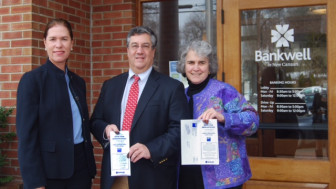 Here's what the brochure looks like. L-R: Heidi DeWyngaert, President of Bankwell New Canaan, Rob Mallozzi, First Selectman, and Kit Devereaux, President of the League of Women Voters New Canaan. Contributed