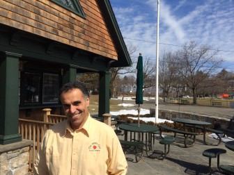 Emad Aziz opens the Apple Cart Food Co. snack shack at Mead Park on Friday, March 27. Here is prepping for the season. Credit: Michael Dinan