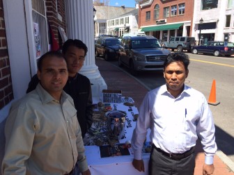 L-R: Keshab Chapaginsharma, a manager at Thali restaurant on Main Street, Krjen Jurung and Mallesh Esarla, also a manager there and all three men Nepalese, are raising money for their home nation in the wake of an earthquake this week whose death toll has exceeded 5,000. Stop by their table on Main Street between 10 a.m. and 3 p.m. Wednesday. Credit: Michael Dinan