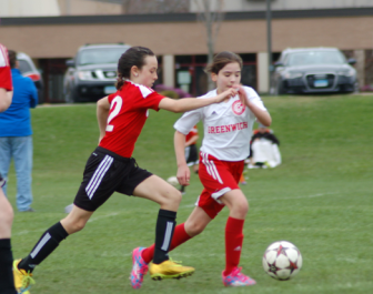 Ava Gizzie moves the ball past a Greenwich defender. Contributed