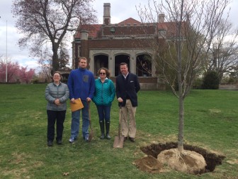 L-R: Selectman Beth Jones, Benjamin Paris, Belinda Winpenny Paris and Public Tree Board Chairman Tom Cronin stand by a copper beech tree, planted this Arbor Day, April 24, 2015, in memory of the late Ted Winpenny of New Canaan. Credit: Michael Dinan