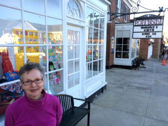 Catherine Seton stands in front of the window display at the Playhouse, which now features items created by the venerable New Canaan Sewing Group. The organization's Spring Boutique, a fundraiser benefitting local nonprofits, is to be held 9 a.m. to 3 p.m. on Friday, April 17 in Morrill Hall at St. Mark’s Episcopal Church. Credit: Michael Dinan