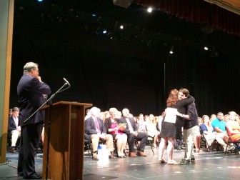 Phyllis Landers Linden hugs Kevin Kurtzman during the 2015 New Canaan High School Recognition Assembly on May 29. Kurtzman won a Drama Award—for Outstanding Achievement in Technical Theatre—from the Kiwanis Club of New Canaan in memory of Peter B. Linden. Credit: Michael Dinan