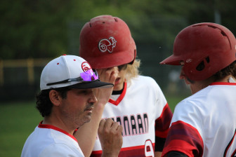 Rams head coach Mitch Hoffman talks strategy during New Canaan's 8-7 win over Greenwich at Mead Park on May 11, 2015. Credit: Terry Dinan