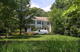 This 2005-built, 5-bedroom Colonial at 48 Spring Water Lane sits on 1.15 acres and sold in June 2015 for $2,395,000. Credit: Michael Dinan